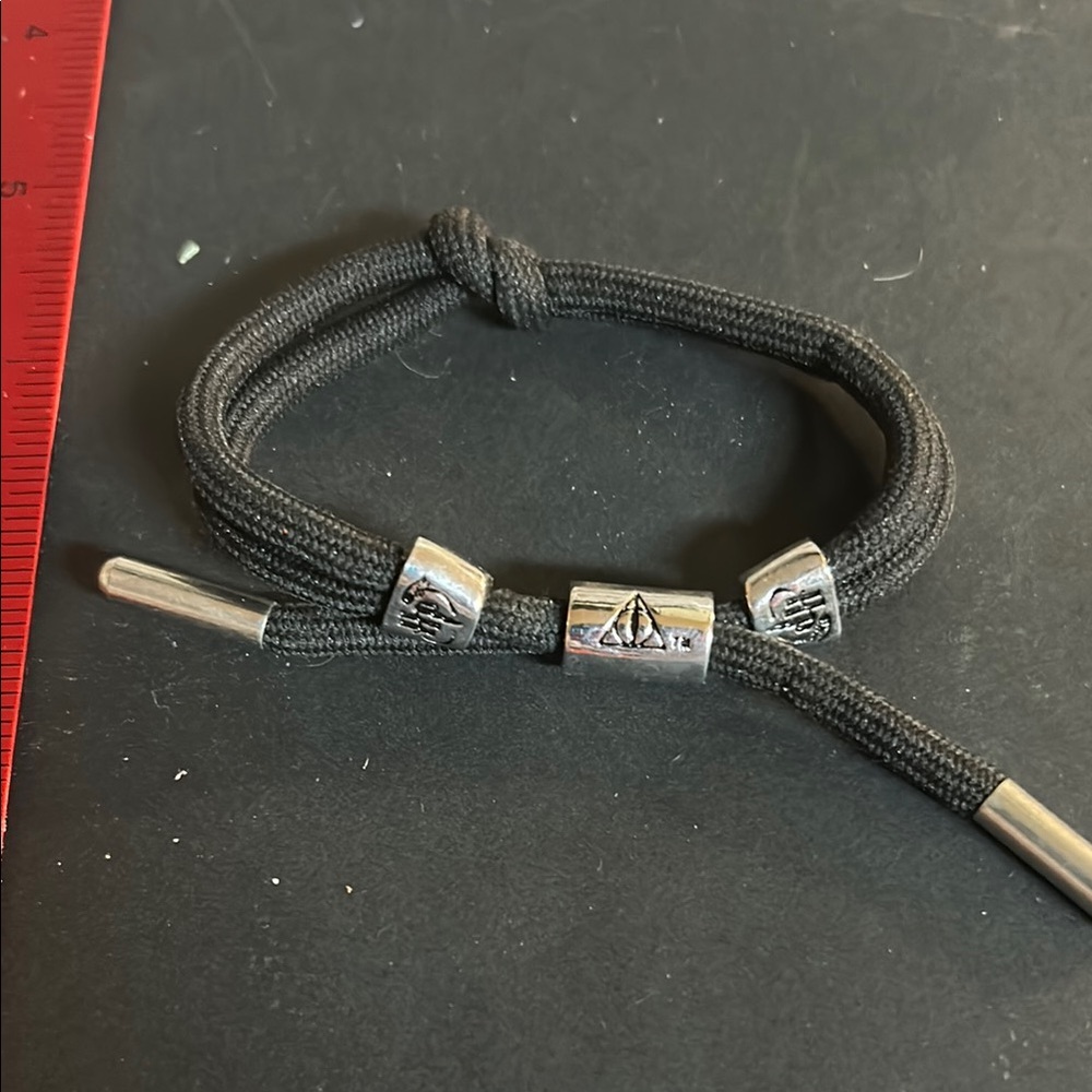 Harry Potter black cord bracelet two silver tone studs